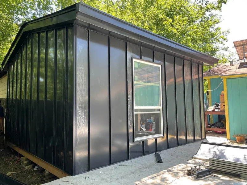 Black standing seam metal wall panels for Roof Inspection in Tuskegee